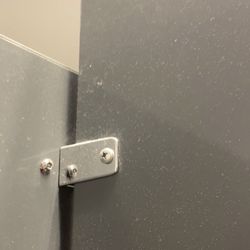 Homegoods 0461 - Dust that has settled on the divider wall of the stall