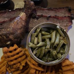 Sliced Brisket, smoked chicken, Sweet Potato Fries, and Green Beans Sliced Brisket, smoked chicken, Sweet Potato Fries, and Green Beans
