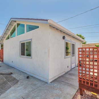 Coleman Construction - a small white house with a red fence - General Contractors Near Me - Los Angeles, California Coleman Construction - a small white house with a red fence - General Contractors Near Me - Los Angeles, California