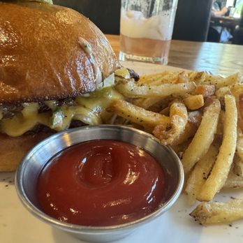 Cork & Pig Tavern - Wagyu Smash Cheeseburger, Hand-Cut French Fries, and Jameson Chambourd Sour - New American Near Me - Irving, Texas