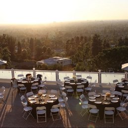 Round Tables, White Folding Chairs & Black Table Linens Round Tables, White Folding Chairs & Black Table Linens