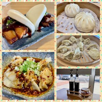Bryan's Dumpling House - Pork Belly Bun, Kurobuta Pork Dumpling in Chili Oil, BBQ Pork Bun, Kurobuta Pork and Cabbage Dumpling - The image features a variety of Chinese dishes including steamed buns, dumplings, and a plate of dumplings with sauce and green onions, along with condiments in bottles. - Dim Sum Near Me - Denver, Colorado