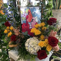 Atascocita Lake Houston Florist - Sun Catcher surrounded with flowers is a perfect gift for any occasion. #cardinals #flowers #suncatchers #gifts