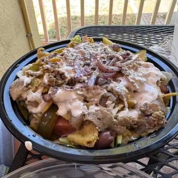 Sam's Cuisine - Big generic bowl of lettuce, mushy tomatoes and processed pasty "lamb" and "chicken" - awful - Mediterranean Near Me - Davis, California