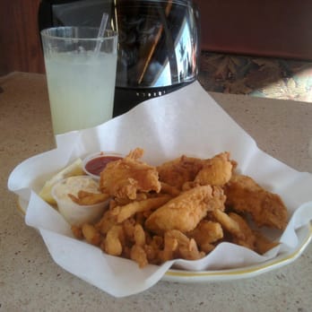 Brad's Restaurant - Seafood combo with fish (probably cod), calamari strips, clam strips, and shrimp. - Seafood Near Me - Pismo Beach, California