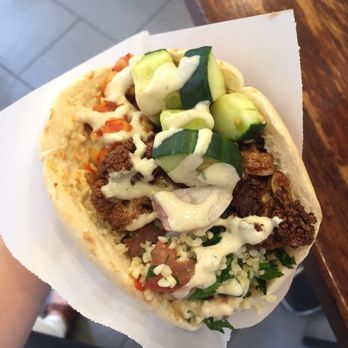 Maoz Falafel - ALL YOU CAN TOP toppings on your falafel. it's amazing. My favorite topping is the cauliflower and the cold slaw! Mmmm - Vegetarian Near Me - Barcelona, B