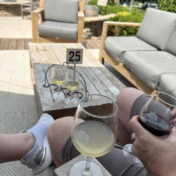 Shady Lane Cellars - Glasses on the patio. Pathfinder, 2016 Sparkling Riesling, Grüner Veltliner - Wineries Near Me - Suttons Bay, Michigan