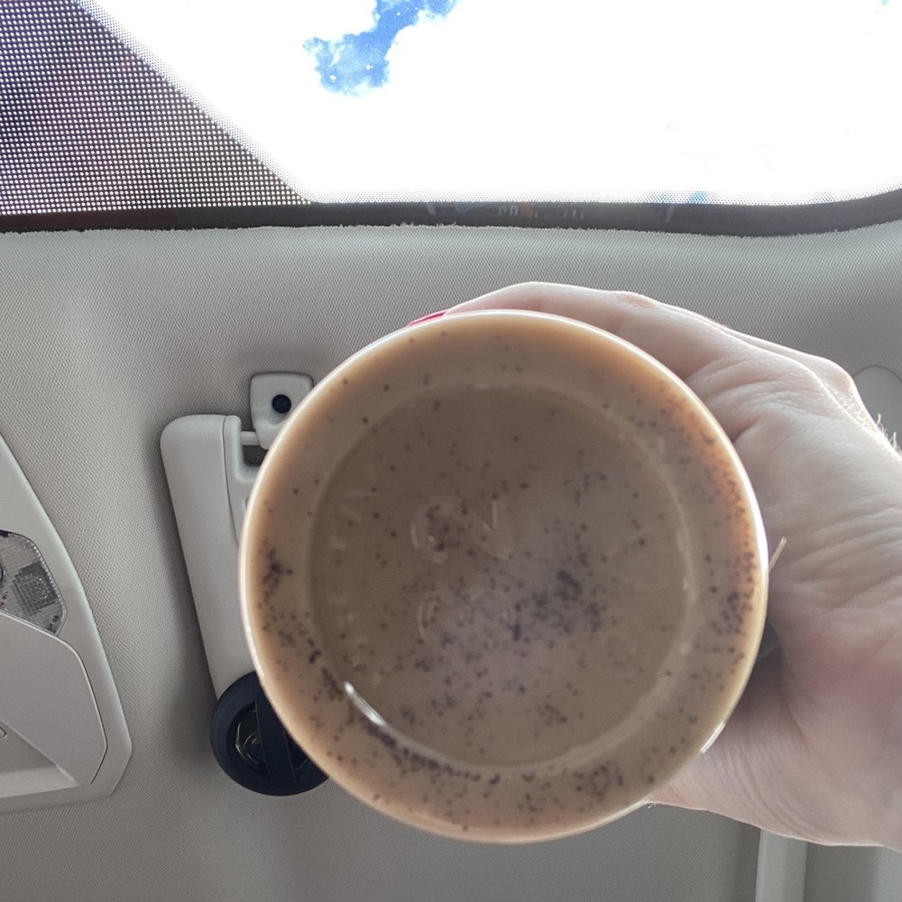 Dunkin' -  a person holding a cup of coffee - Donuts Near Me - New Port Richey, Florida