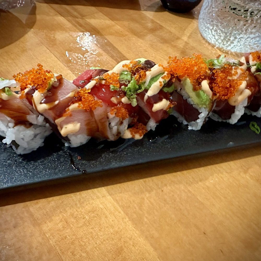 Kazoku Roll - tuna, hamachi topped w/ tuna, hamachi, avocado, tobiko, scallion, spicy aioli and unagi sauce Kazoku Roll - tuna, hamachi topped w/ tuna, hamachi, avocado, tobiko, scallion, spicy aioli and unagi sauce