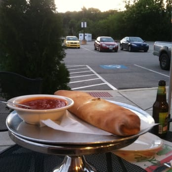 Mr. P Pizza & Pasta - Eating Stromboli at outside table overlooking parking lot. - Pizza Near Me - Flourtown, Pennsylvania Mr. P Pizza & Pasta - Eating Stromboli at outside table overlooking parking lot. - Pizza Near Me - Flourtown, Pennsylvania