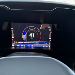 Supreme Chevrolet of Gonzales - the dash showing the obvious light and the warning that pops up on it.