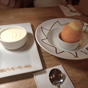 Toros Restaurant - Keskul (Almond pudding) & Orange Şerbet served in a hollowed out orange. - Turkish Near Me - Clifton, New Jersey