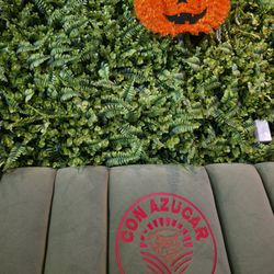 Con Azucar Café - They're ready for Halloween. Cute deco behind one of their seating area.