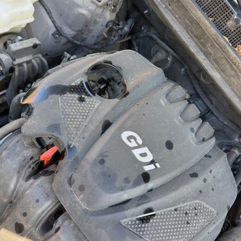 Take 5 Oil Change - Oil on the engine cover. - Oil Change Stations Near Me - Garland, Texas