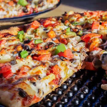 Westside Pizza - two slices of pizza on a grill - Pizza Near Me - Fircrest, Washington