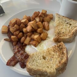 Mel's Raspberry Patch - 3 Eggs over medium bacon and deep fried home fries