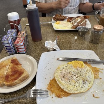 The Landings - Two eggs any style, hash browns, sour dough toast. - American Near Me - Henderson, Nevada The Landings - Two eggs any style, hash browns, sour dough toast. - American Near Me - Henderson, Nevada