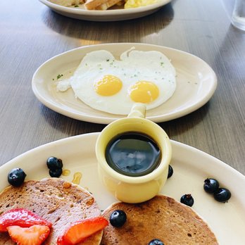 Snooze, an A.M. Eatery - Vegan Bliss Pancakes + a side of 2 sunny side up eggs, Snooze Classic + a side of hash - Breakfast & Brunch Near Me - Austin, Texas Snooze, an A.M. Eatery - Vegan Bliss Pancakes + a side of 2 sunny side up eggs, Snooze Classic + a side of hash - Breakfast & Brunch Near Me - Austin, Texas