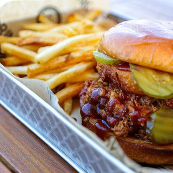 Loft18 - a pulled pork sandwich and french fries - Sports Bars Near Me - Metairie, Louisiana Loft18 - a pulled pork sandwich and french fries - Sports Bars Near Me - Metairie, Louisiana