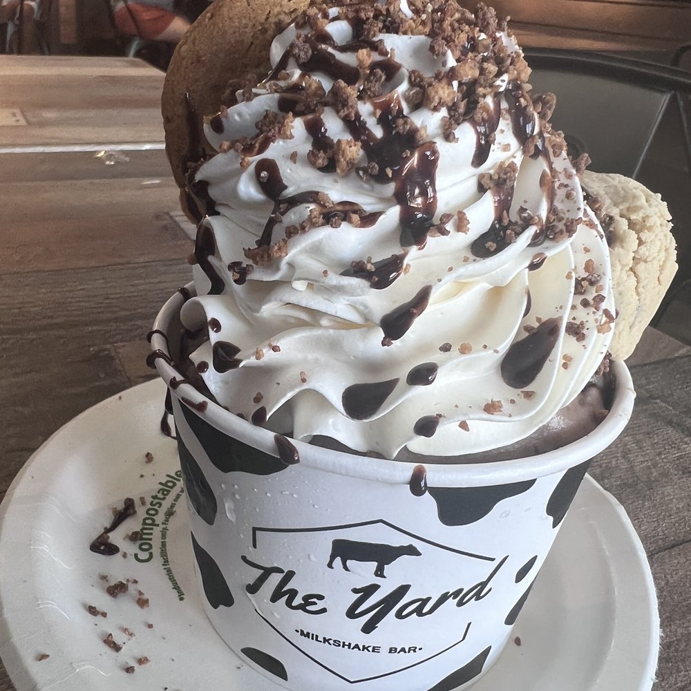 The Yard Milkshake Bar - "Not Milk?" Vegan $14 made with Oatly Chocolate Ice Cream, vegan cookie dough, vegan whip and vegan chocolate chip cookies. - Ice Cream & Frozen Yogurt Near Me - Virginia Beach, Virginia The Yard Milkshake Bar - "Not Milk?" Vegan $14 made with Oatly Chocolate Ice Cream, vegan cookie dough, vegan whip and vegan chocolate chip cookies. - Ice Cream & Frozen Yogurt Near Me - Virginia Beach, Virginia