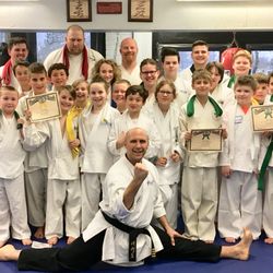 Freedom Martial Arts & Fitness - Freedom Martial Arts students strike a pose after youth class.