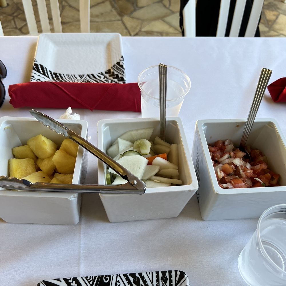 Hale Koa Luau - a variety of food items on a table - Performing Arts Near Me - Honolulu, Hawaii