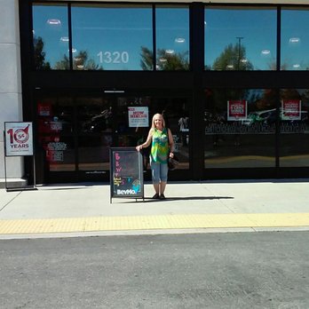 BevMo! - a woman standing in front of a store - Beer, Wine & Spirits Near Me - Redding, California