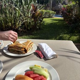 Club sandwich and fruit plate