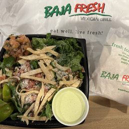 a salad and a bag of chips a salad and a bag of chips