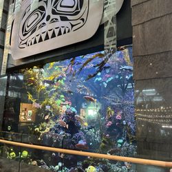 Go pass the aquarium to the left and you'll see the sign to the lounge near gate 53