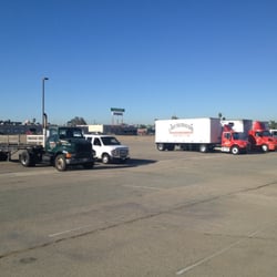 DMV Field Office San Bernardino - Various trucking schools waiting to take drive tests.
