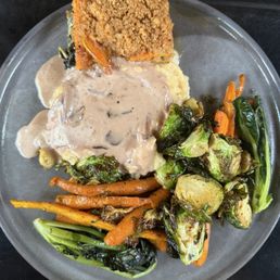 Vegetarian entre. Mushroom gravy on mashed potatoes roasted veg and some kind or augratin Vegetarian entre. Mushroom gravy on mashed potatoes roasted veg and some kind or augratin