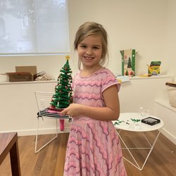 KMH Toys - Anastasia built our Christmas tree for our opening day.