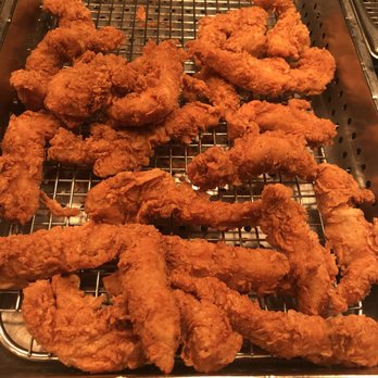 Chicken Express - a close up of a fried chicken in a deep fryer - Fast Food Near Me - Willow Park, Texas