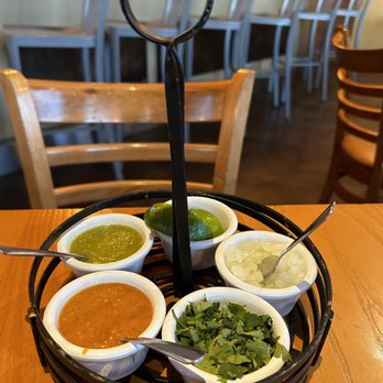 El Tizoncito - a variety of condiments on a tray - Mexican Near Me - Dallas, Texas El Tizoncito - a variety of condiments on a tray - Mexican Near Me - Dallas, Texas