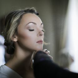 JoAnne Wolf's airbrush contouring made me feel like a glowing bride the entire night.