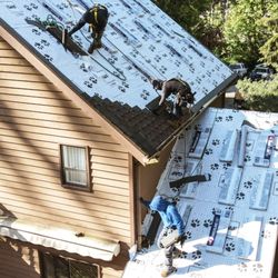 Veterans Roofing - Roofers working on the roof, new roof installation