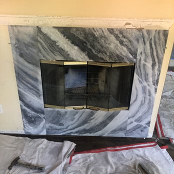 Tile Master - a fireplace being installed in a living room - General Contractors Near Me - Poway, California Tile Master - a fireplace being installed in a living room - General Contractors Near Me - Poway, California