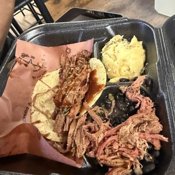 Texican BBQ - Wednesday special--Two entrees with two sides: pork belly and brisket tacos, cheesy mash, and corn fritters all under $25. - Food Trucks Near Me - Olmito Texas, Texas