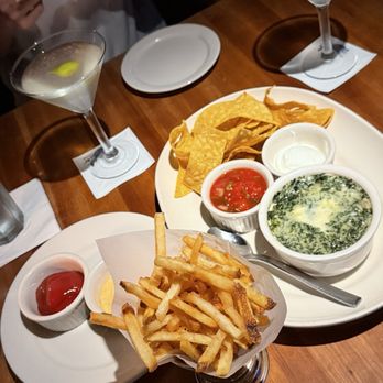 Hillstone Restaurant - Crisp martini, fries, and Spinach & Artichoke Dip - New American Near Me - Winter Park, Florida