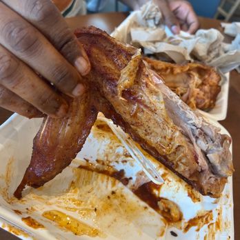 Mi Cocina - a person grabbing a piece of meat from a plate - Mexican Near Me - Fort Worth, Texas Mi Cocina - a person grabbing a piece of meat from a plate - Mexican Near Me - Fort Worth, Texas