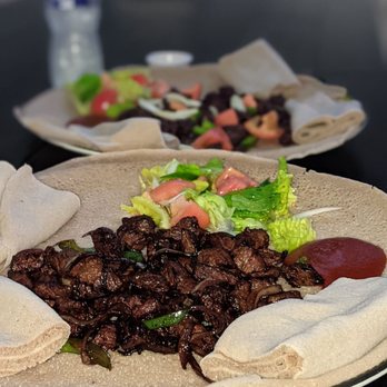 Meda Restaurant - two plates of food on a table - Ethiopian Near Me - Alexandria, Virginia