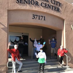 Our volunteers at our entrance facing the SunBus Stops