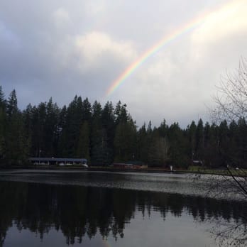 Sunset Lake Camp - Rainbow over the lake. You can see the dining hall and gym. - Summer Camps Near Me - Wilkeson, Washington Sunset Lake Camp - Rainbow over the lake. You can see the dining hall and gym. - Summer Camps Near Me - Wilkeson, Washington
