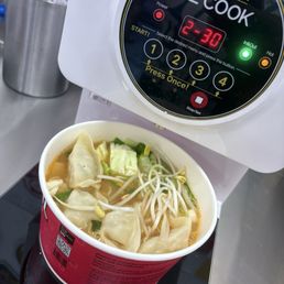 Making the ramen, with toppings.