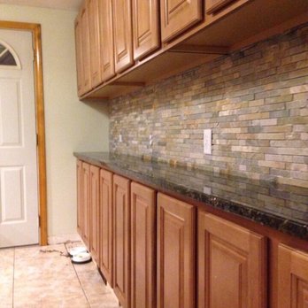JDH Home Improvement - Natural stone backsplash. Walnut cabinets and black granite. - Drywall Installation & Repair Near Me - Warwick, Rhode Island