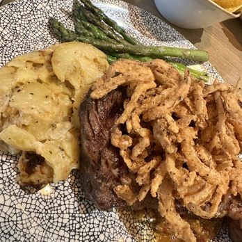 Caló Kitchen + Tequila - Rib-eye, jalapeño scalloped potatoes and asparagus - Cocktail Bars Near Me - Costa Mesa, California