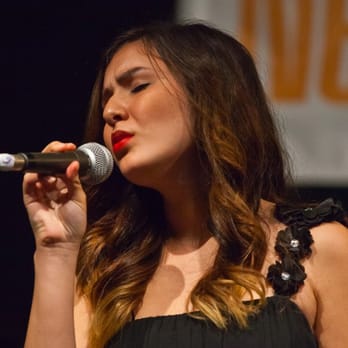 Next Generation Jazz Festival - a woman singing into a microphone - Jazz & Blues Near Me - Monterey, California Next Generation Jazz Festival - a woman singing into a microphone - Jazz & Blues Near Me - Monterey, California