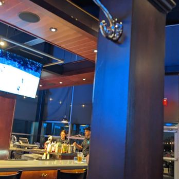 Marina Grill - Ahhh coat hooks. I LOVE when a place provides these and purse hooks at the bar seating, which they do but I didn't have a purse that night. - American Near Me - Wilmington, North Carolina