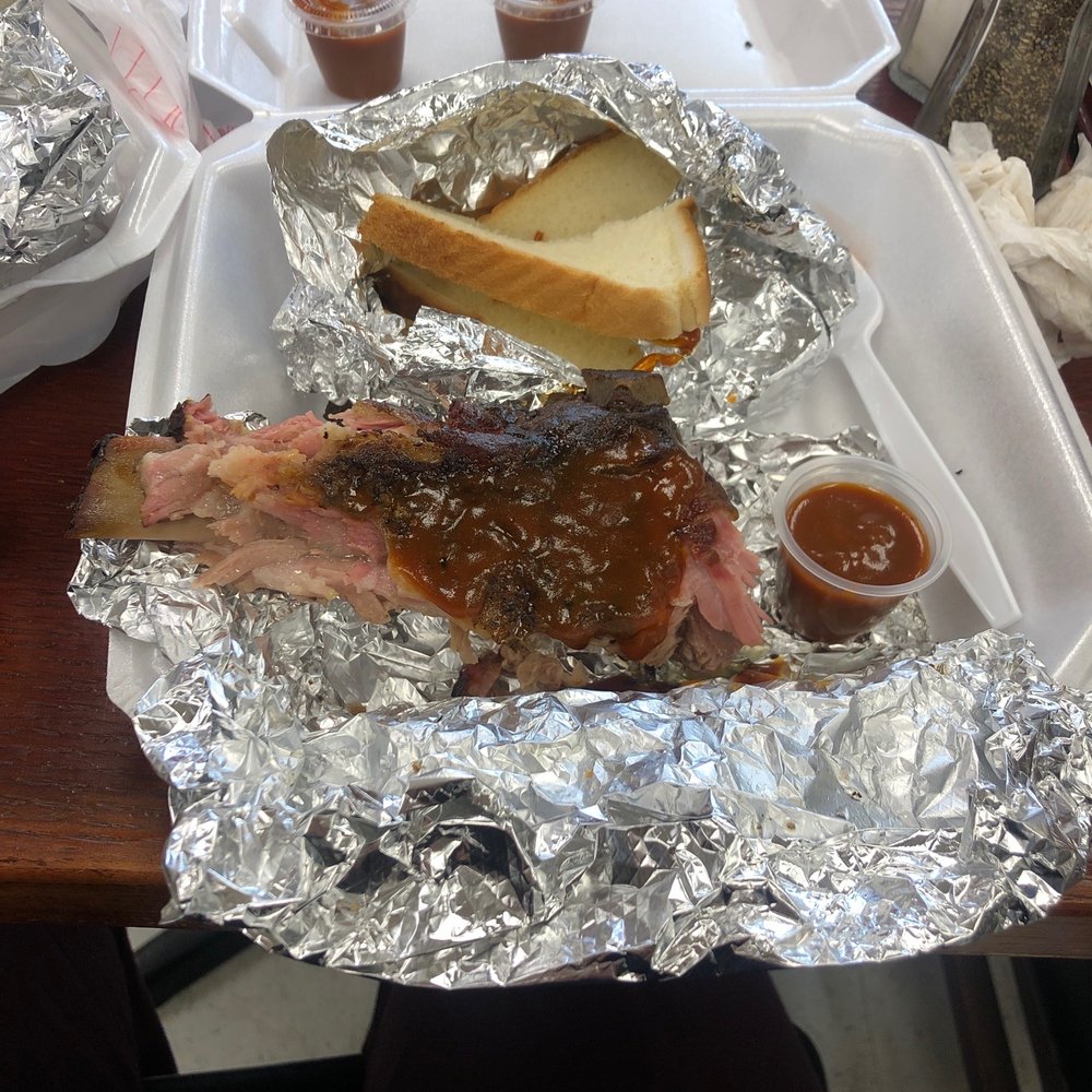 Butts To Go - Partially eaten spare ribs with white bread. Great bbq smoke flavor and really tender! - Barbeque Near Me - Pell City, Alabama Butts To Go - Partially eaten spare ribs with white bread. Great bbq smoke flavor and really tender! - Barbeque Near Me - Pell City, Alabama